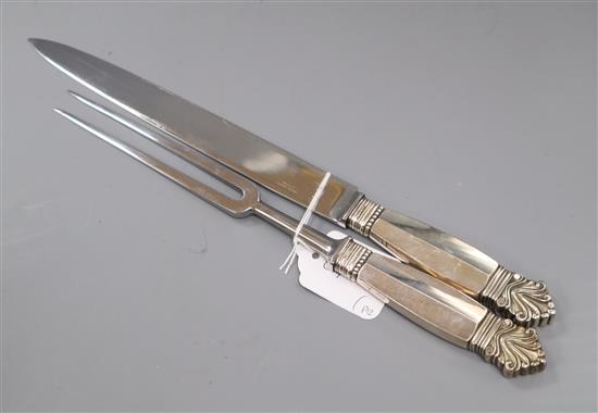 A Georg Jensen sterling handled acanthus pattern carving knife and fork, knife 34.6cm.